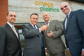 Omega Plastics' Dave Crone receiving keys to their new offices